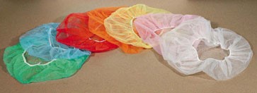 A bunch of different colored plastic hats sitting on top of a table.