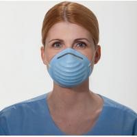 A woman wearing an blue surgical mask.