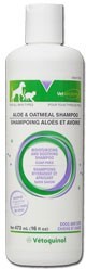 A bottle of shampoo for dogs with aloe and oatmeal.