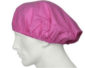 Pink shower cap on mannequin head